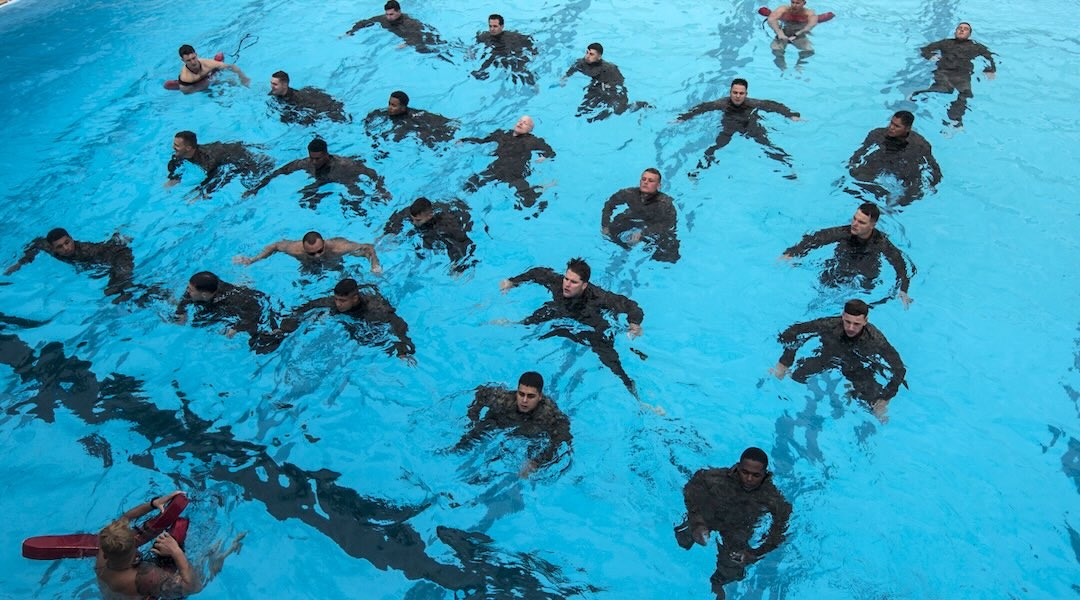 Marines with the 31st Marine Expeditionary Unit’s Maritime Raid Force supervise Marines treading water during a reconnaissance screening at Camp Hansen, Okinawa, Japan, Oct. 27, 2017. MRF specializes in reconnaissance from the sea, vessel Visit, Board, Search and Seizure (VBSS) operations, and limited combat operations as the reconnaissance force of the 31st Marine Expeditionary Unit. The 31st MEU provides a flexible force ready to perform a wide range of military operations, from limited combat to humanitarian assistance, throughout the Indo-Asia-Pacific region as the Marine Corps’ only continuously forward-deployed MEU. (U.S. Marine Corps photo by Cpl. Stormy Mendez)